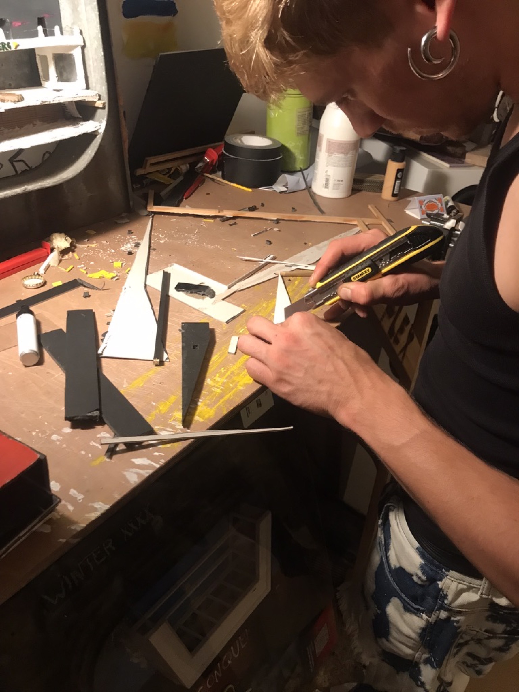 Cutting found cardboard for the miniature building