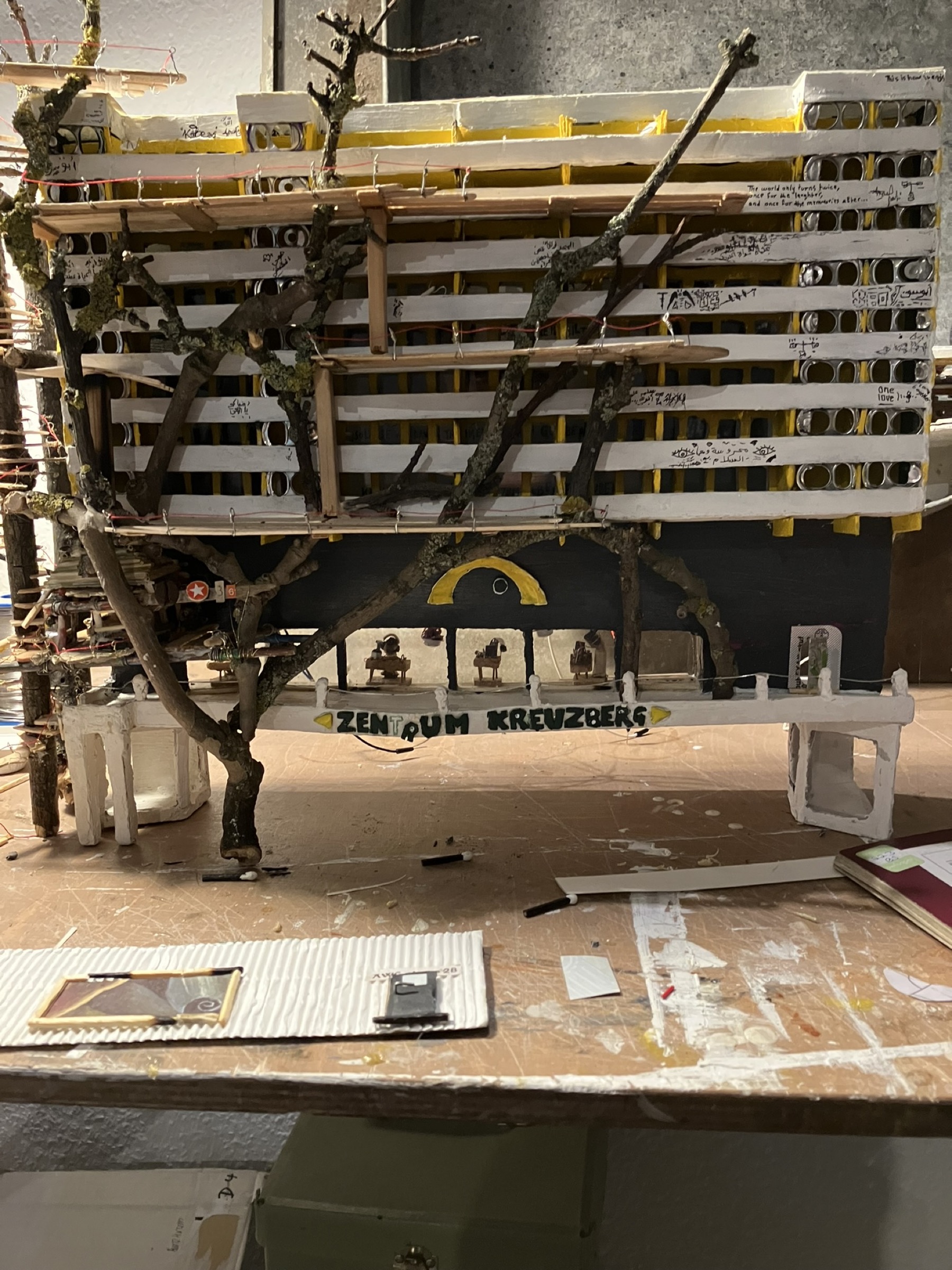 Cigarette figures playing synthesizers in the sound studio before its rear wall is installed