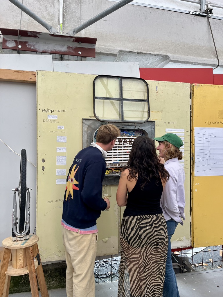 Visitors creating electricity to light up STOP WARS during exhibition