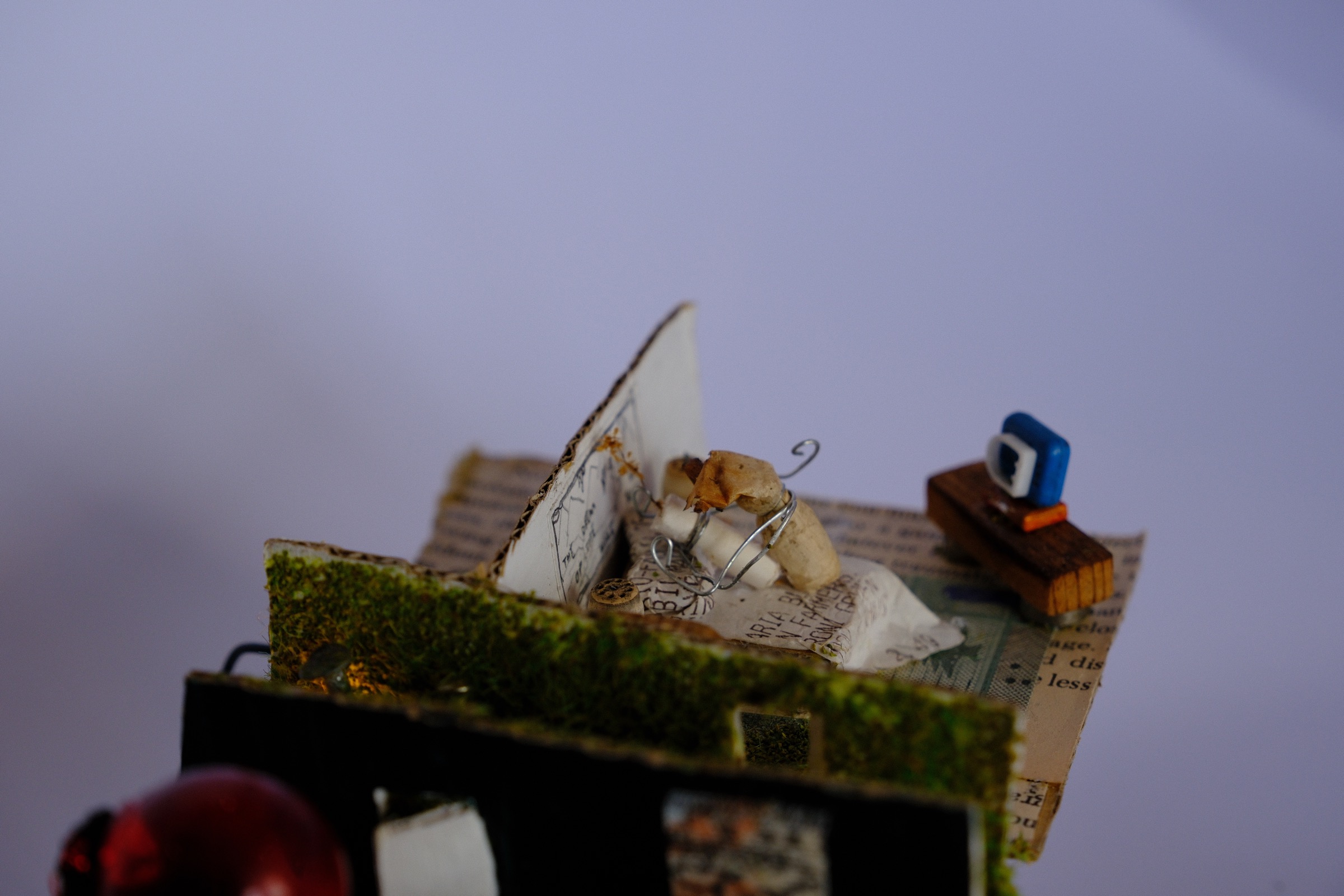 Two miniature cigarette figures sharing an intimate encounter